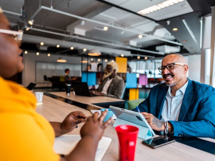 Two people talking in an office